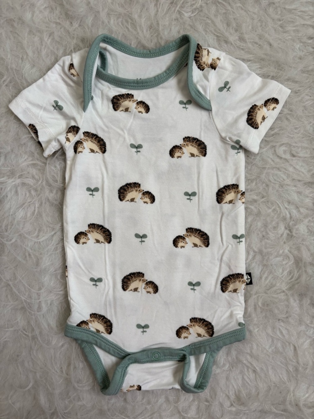 Kyte BABY Gender Neutral Bamboo White Hedgehog Print Bodysuit with Sage Trim